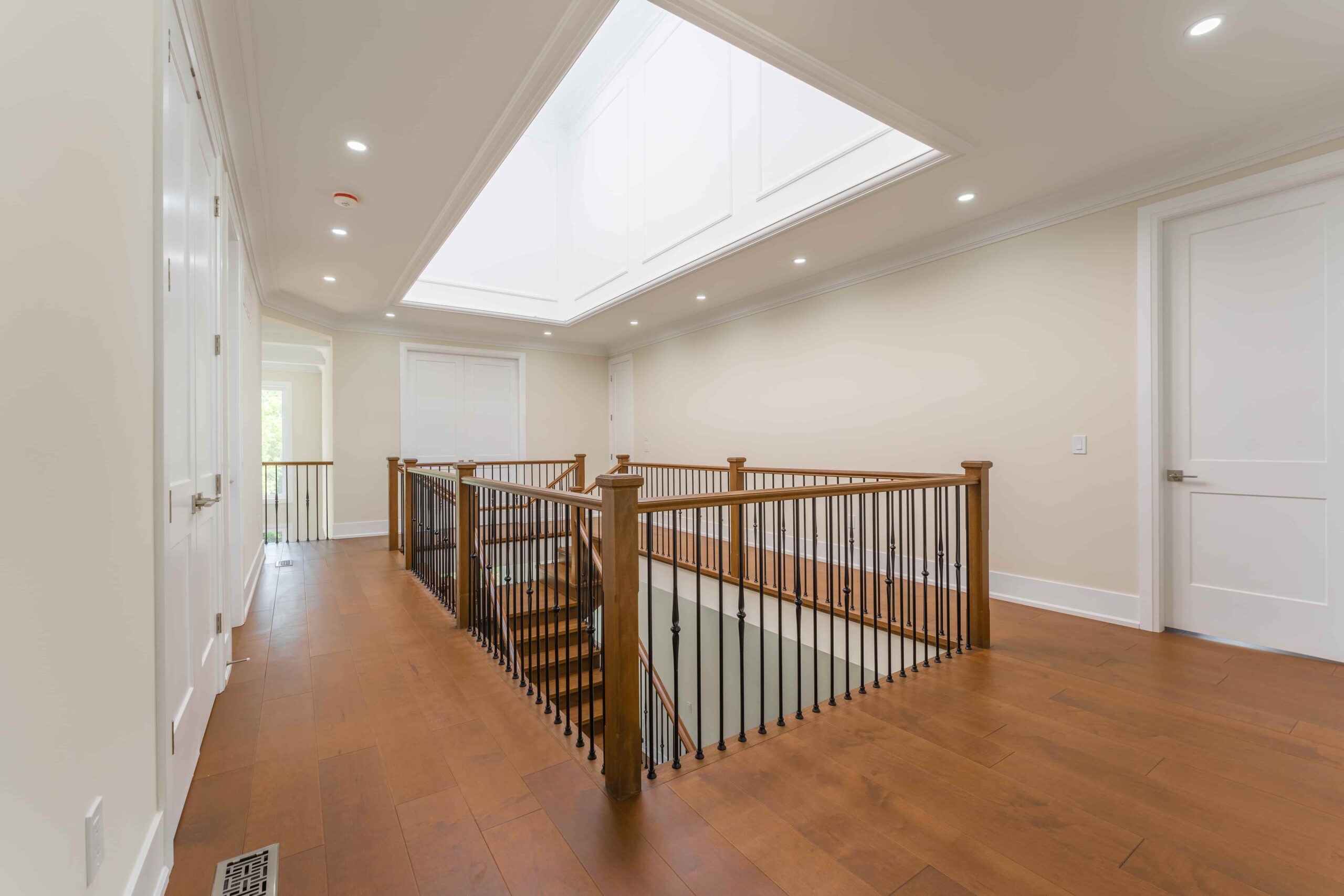 Happy homeowners inside new custom home in GTA