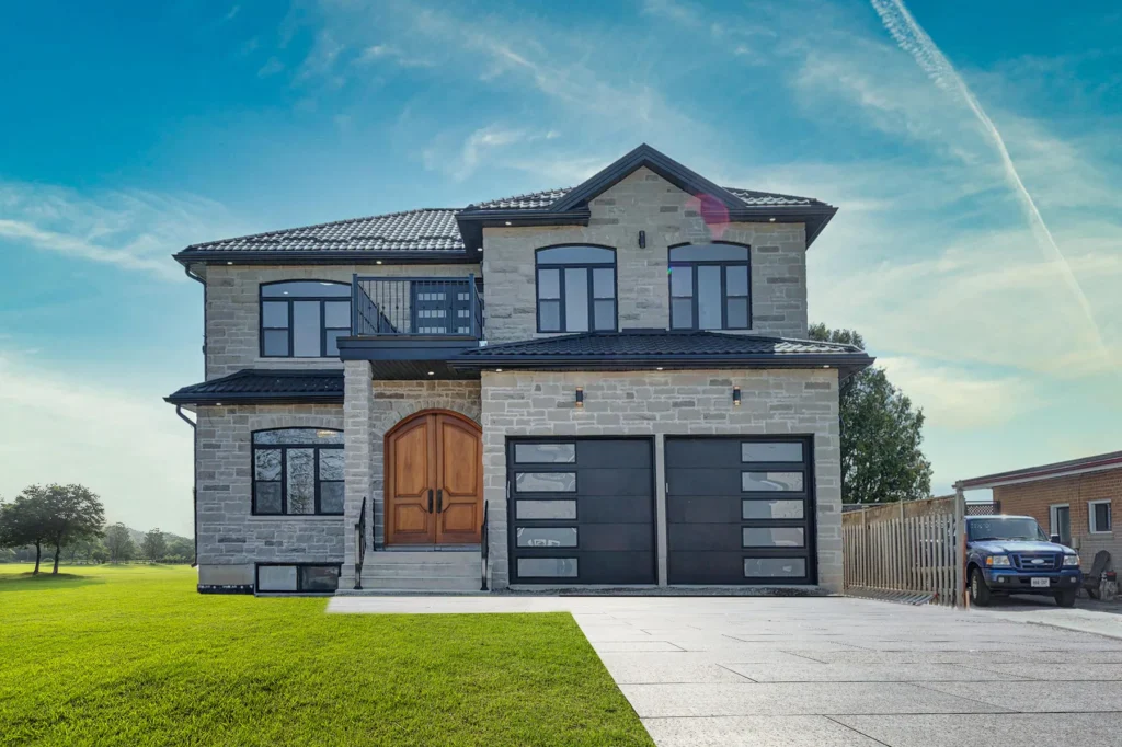 Stone front elevation of a custom home at 3102 Bonaventure