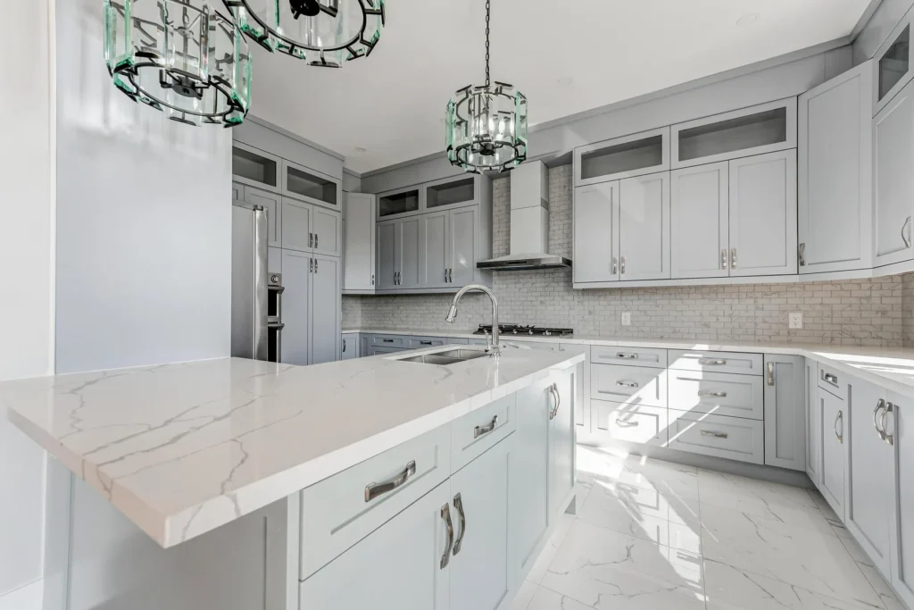 Sage green kitchen with waterfall marble island, 3102 Bonaventure