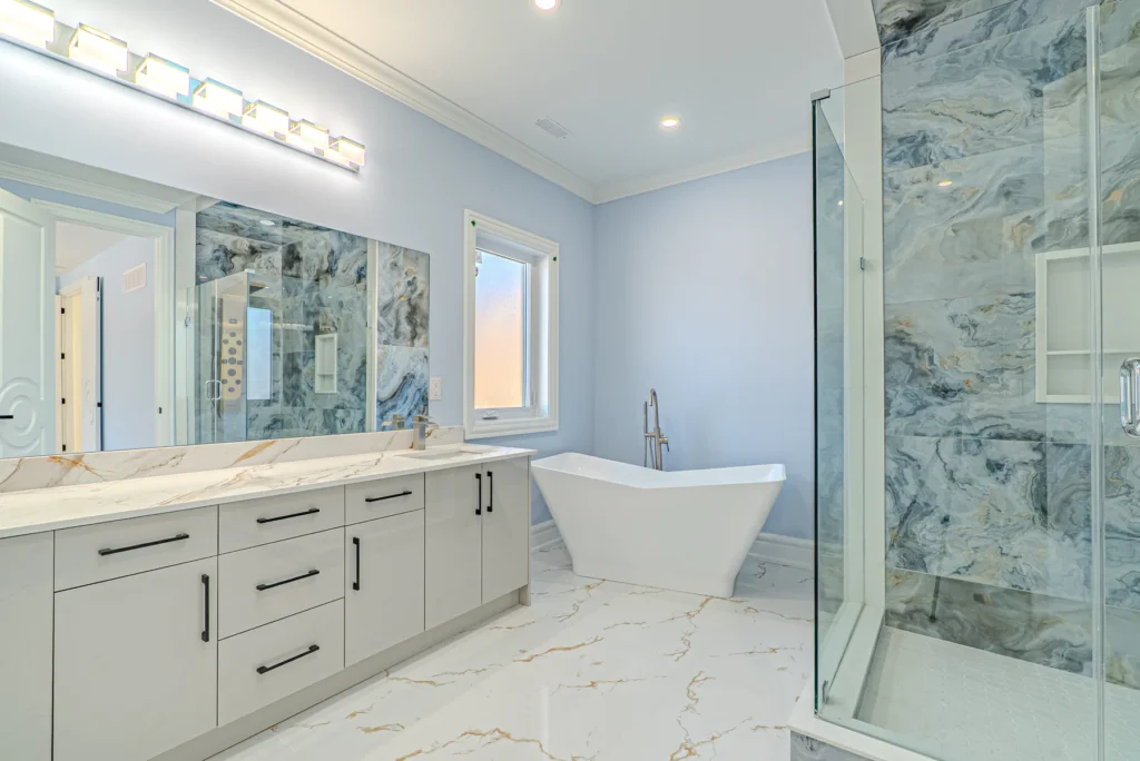 Primary ensuite with full marble slab wall, Michaud
